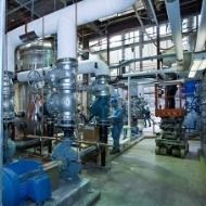 A factory filled with lots of pipes and machinery.