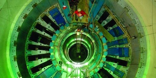 A person is standing in the middle of a large circular object.