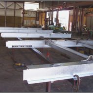 A bunch of metal beams are sitting in a room