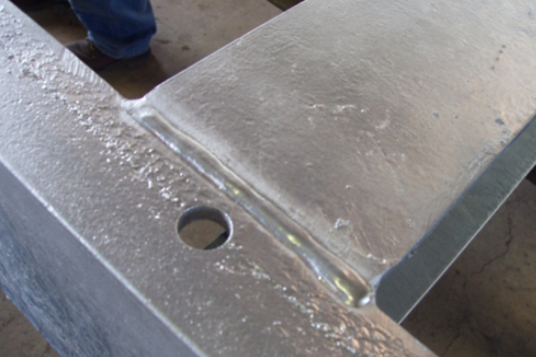 A close up of a piece of metal with a hole in it