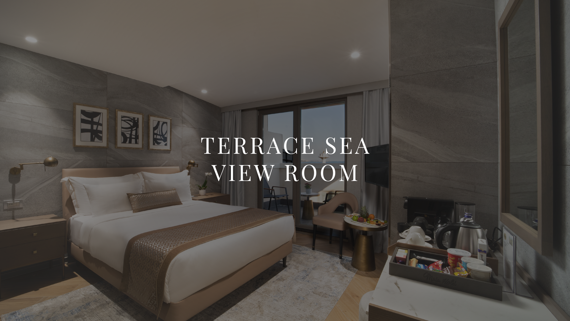 Modern hotel room with king bed, balcony view, and vanity