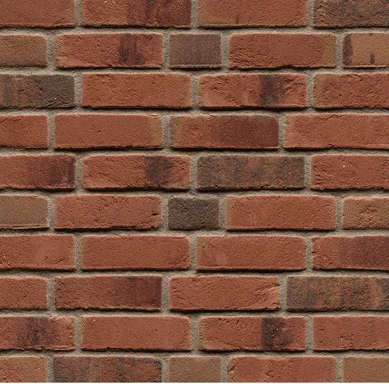 Red and brown brick wall with a running bond pattern.