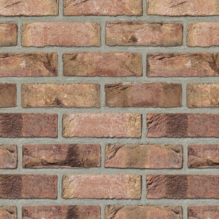 Red and brown brick wall with gray mortar.