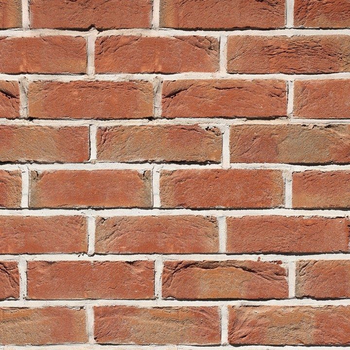 Red brick wall with white mortar.