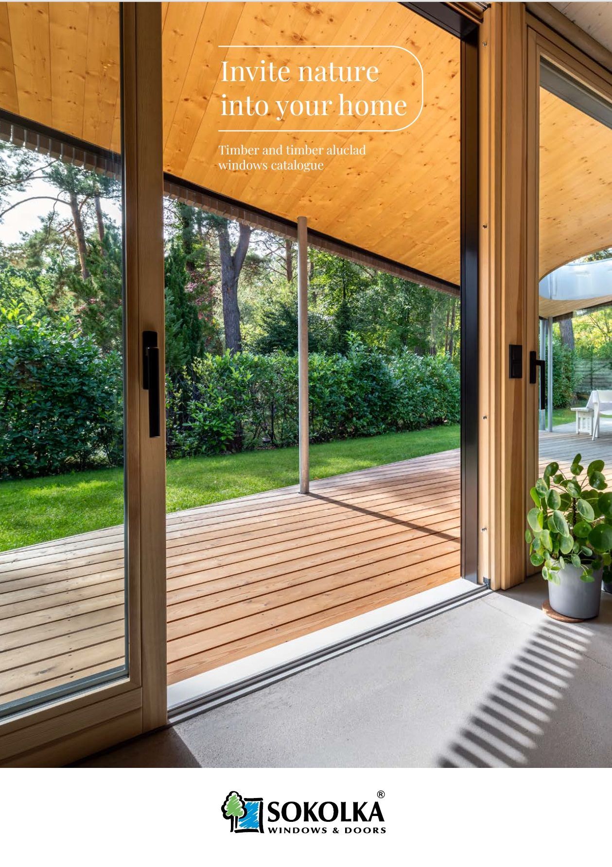 Sliding glass door open to a wooden deck, overlooking a green yard. Text reads: 