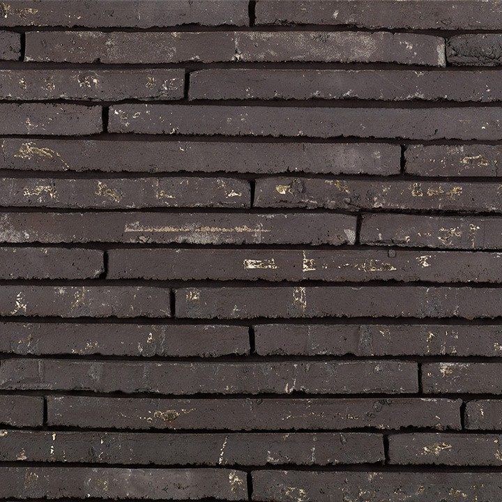 Dark gray brick wall with irregular horizontal lines.