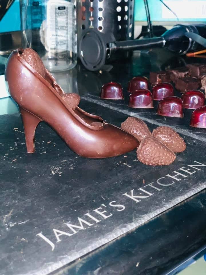 Moulded chocolate shape on dark surface