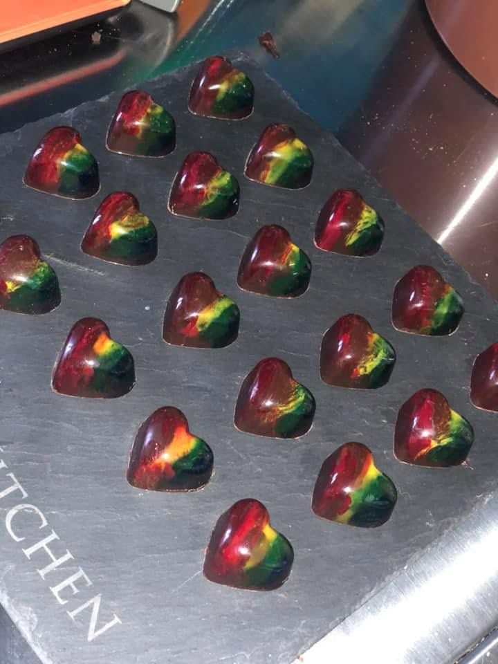 Close-up of hand-painted bonbon shells from a bespoke commission
