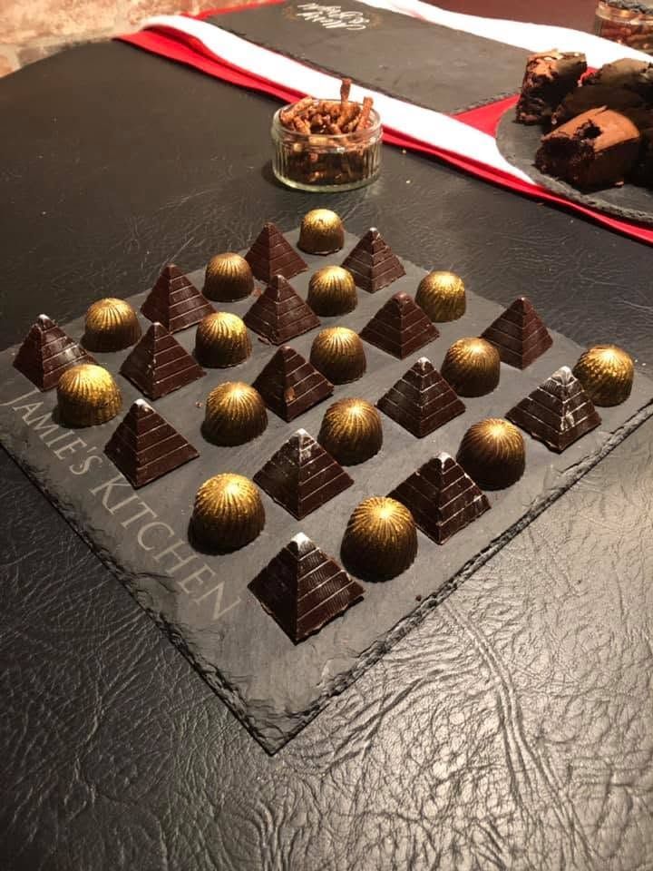 Seasonal Christmas bespoke chocolate assortment with decorated surface finishes