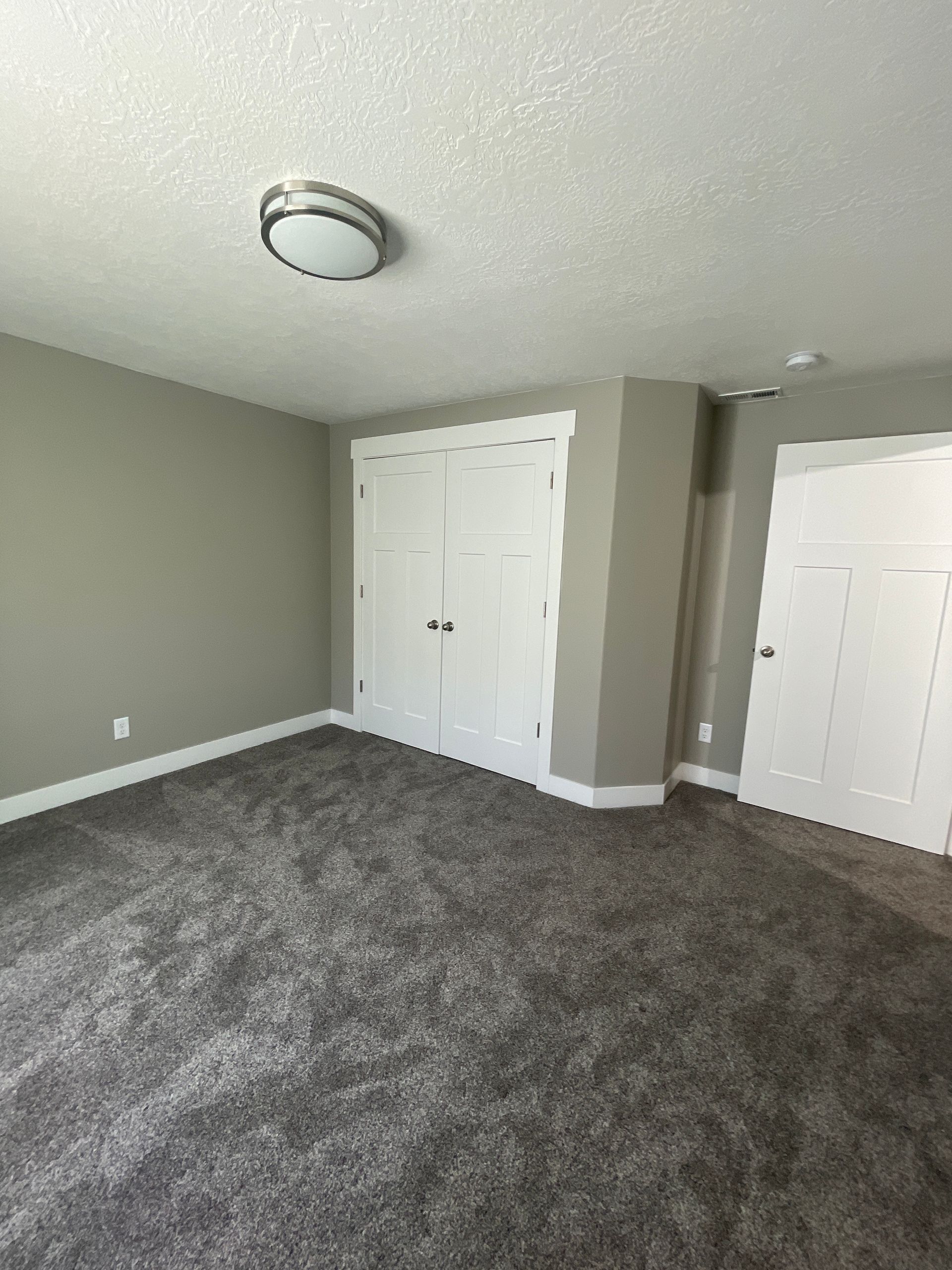 There is a large closet in the middle of the room.
