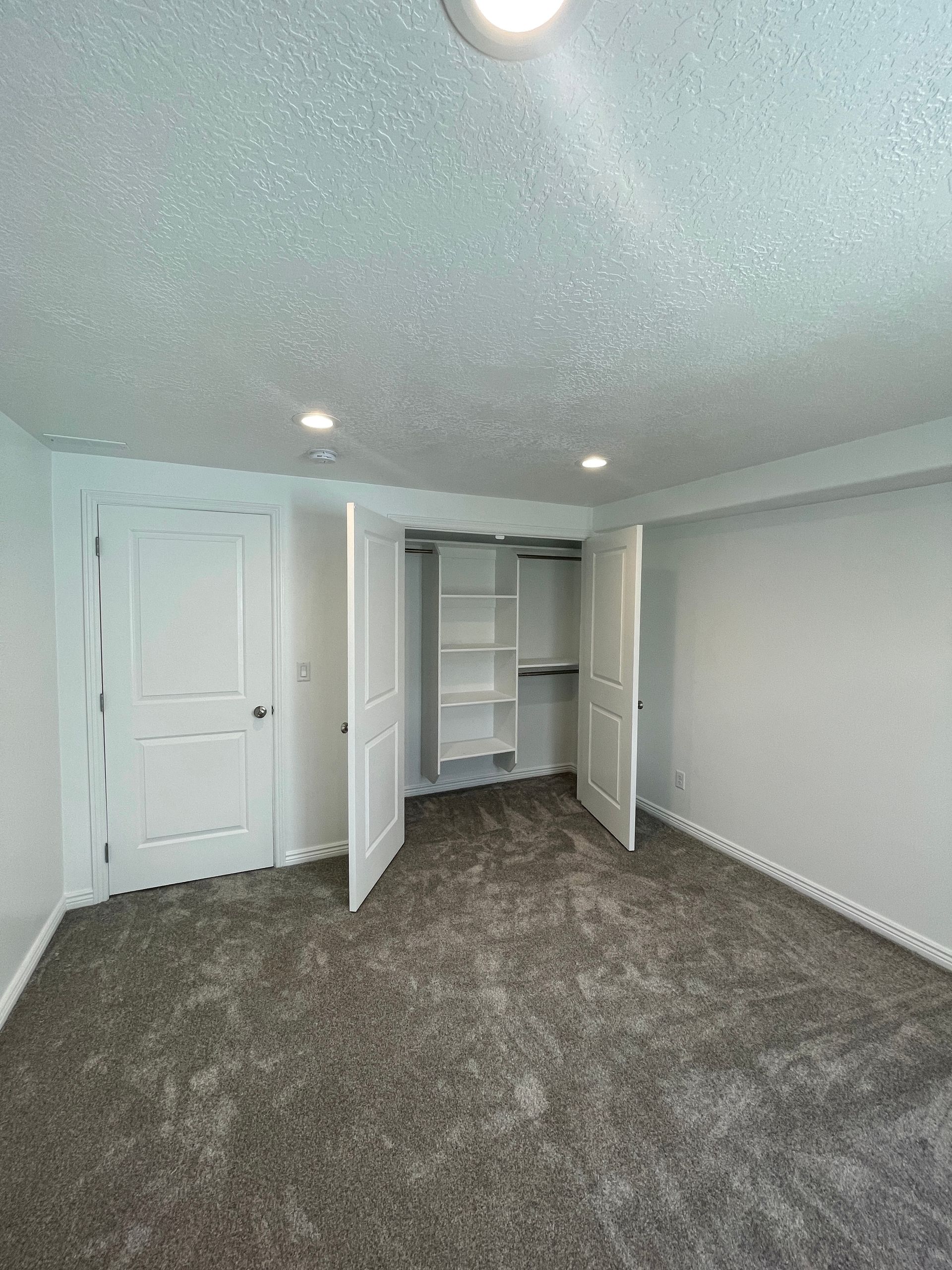 There is a closet in the corner of the room.