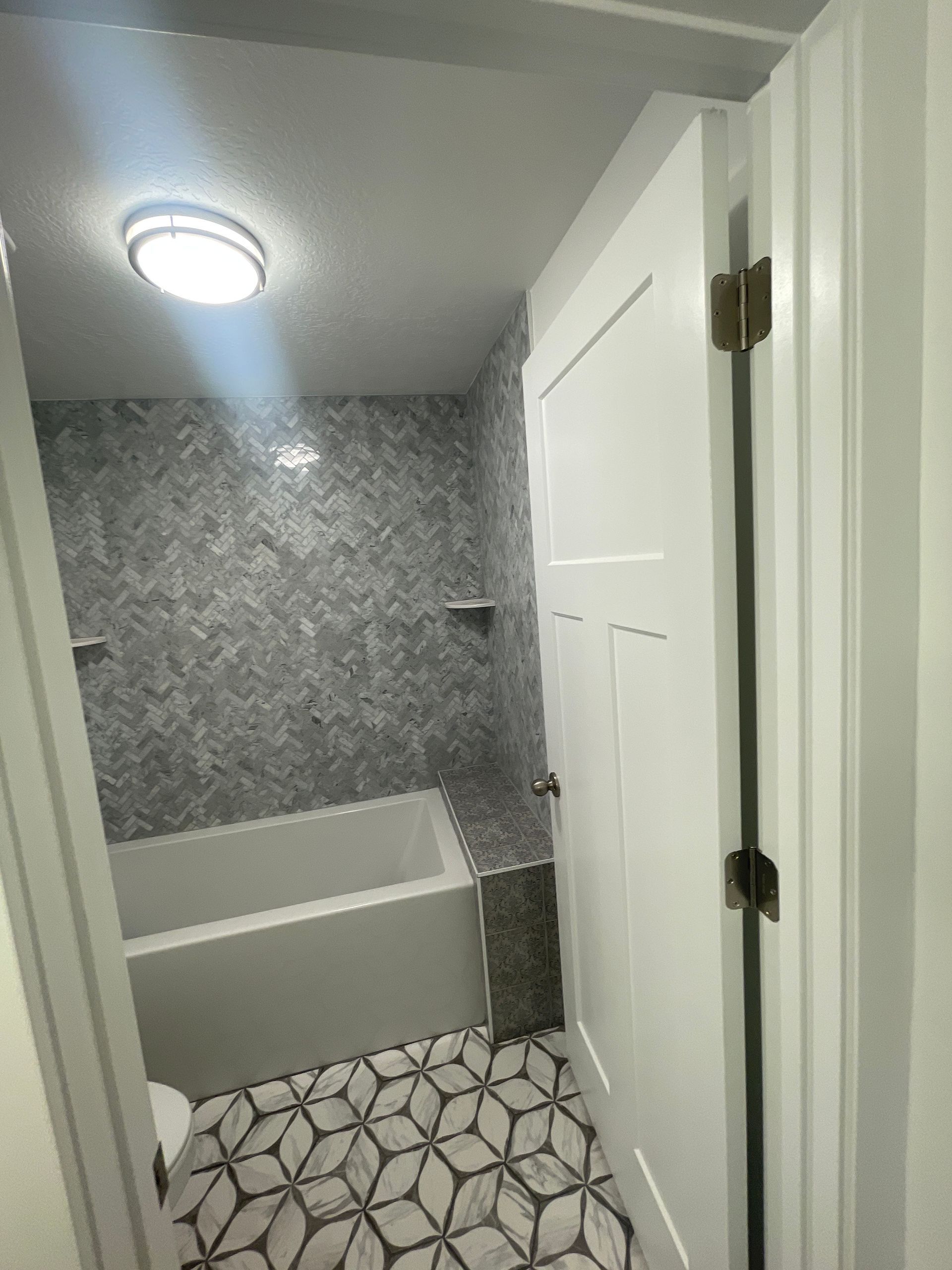A bathroom with a bathtub and a toilet.