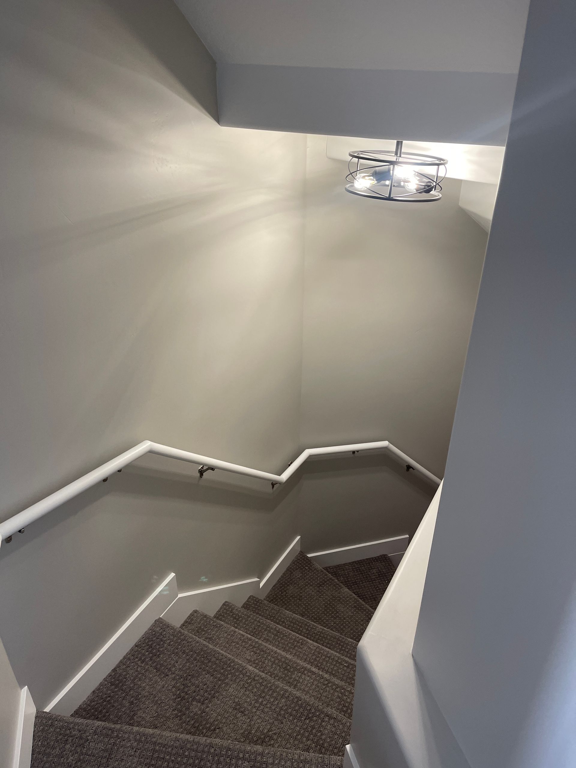 A set of stairs leading up to the second floor of a house.