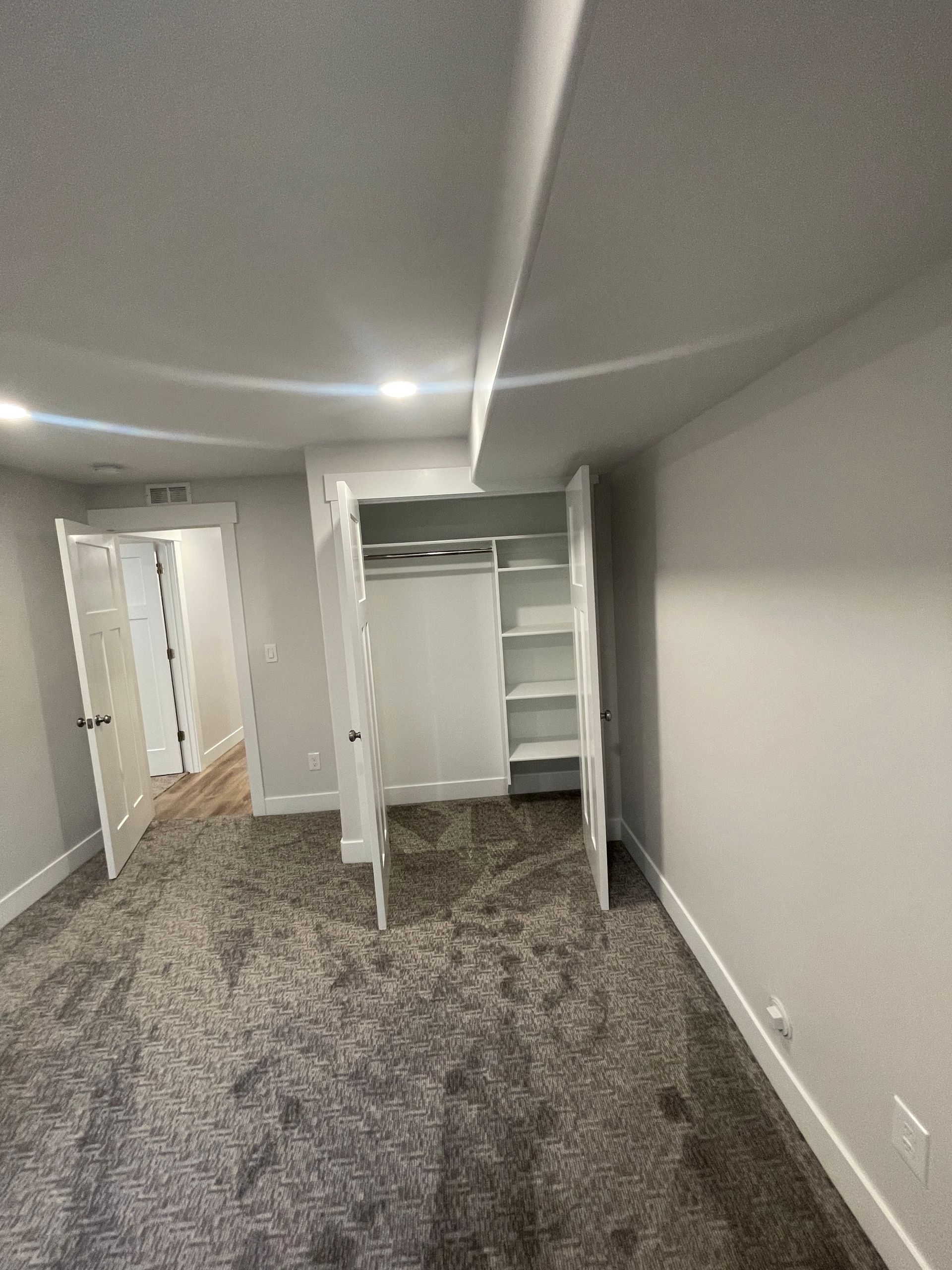 There is a closet in the corner of the room.