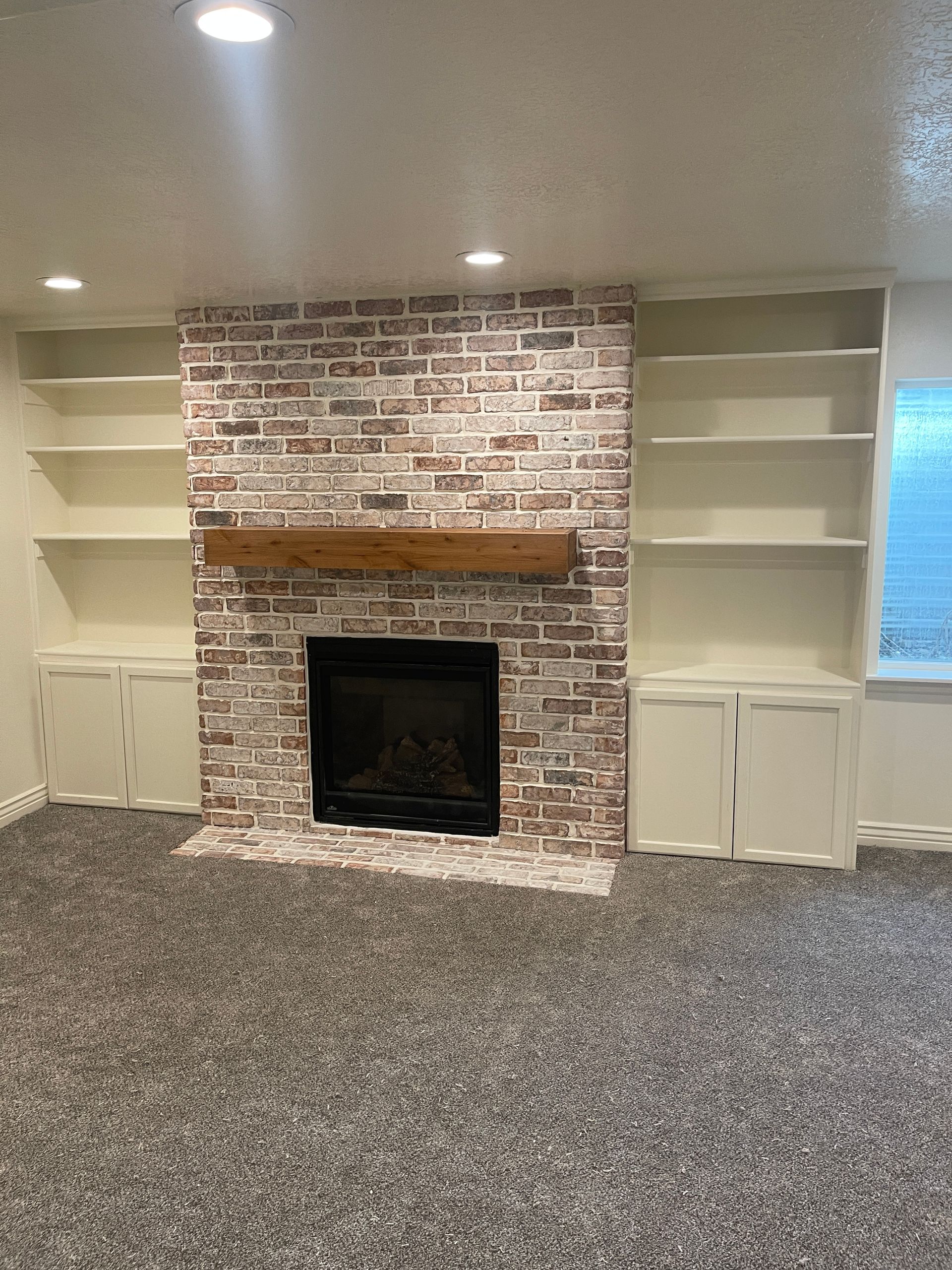 There is a fireplace in the middle of the room.