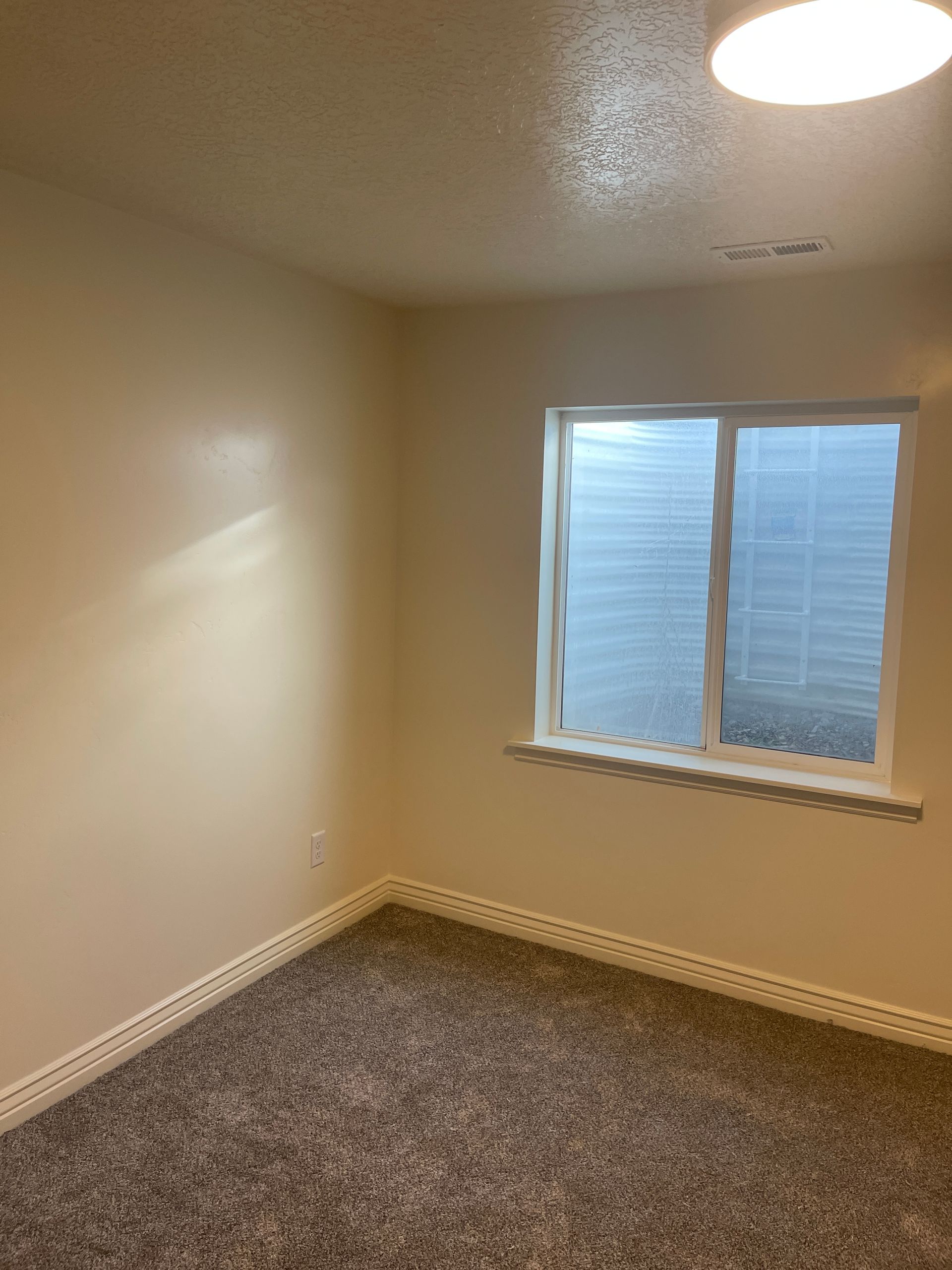 There is a window in the middle of the room.