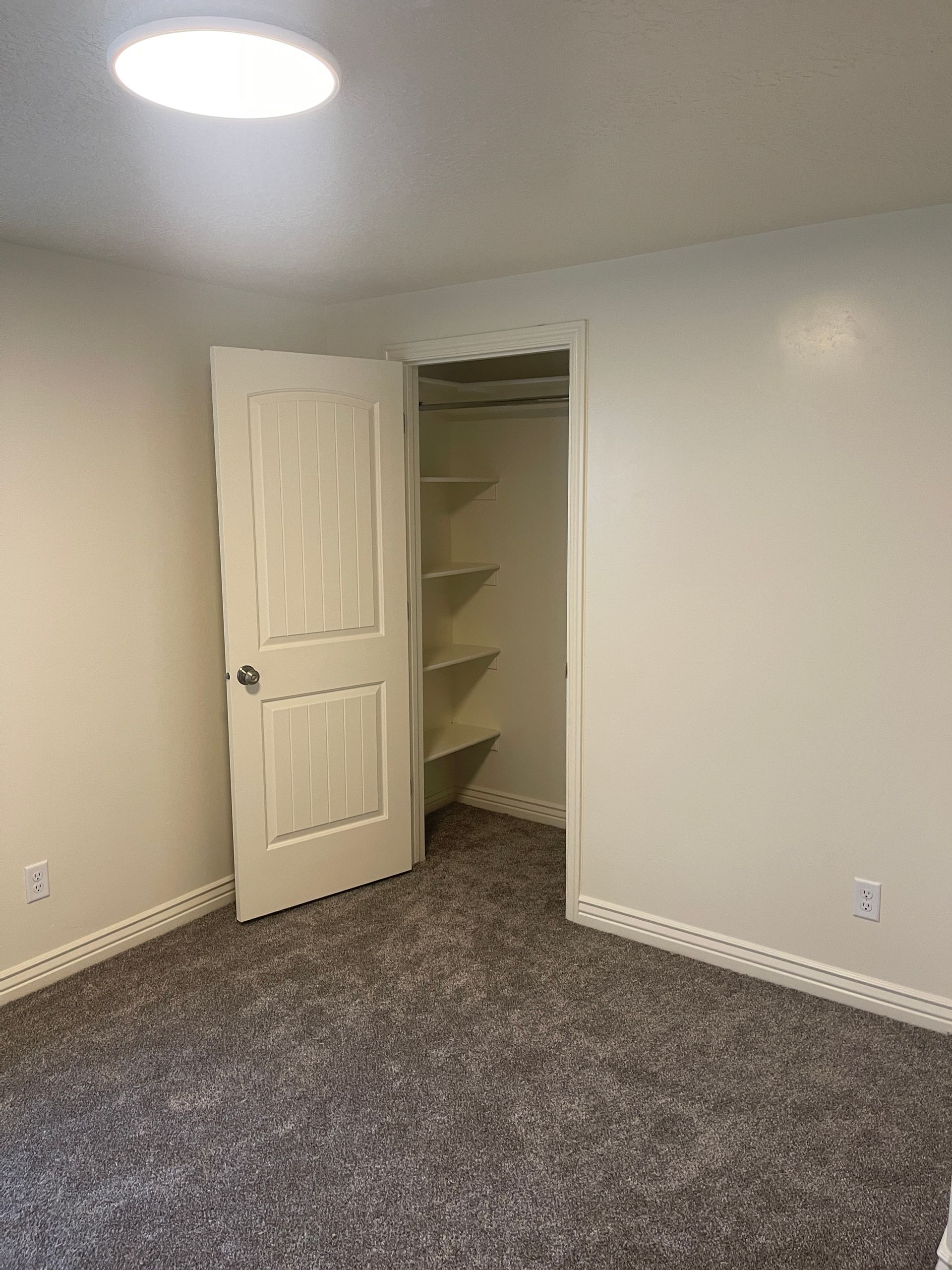 There is a closet in the corner of the room.