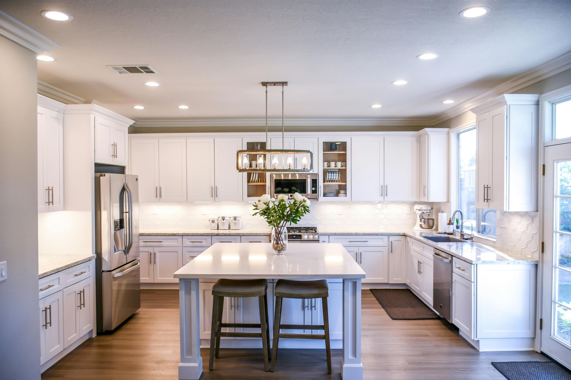 White kitchen cabinets, LVP flooring, basement finish