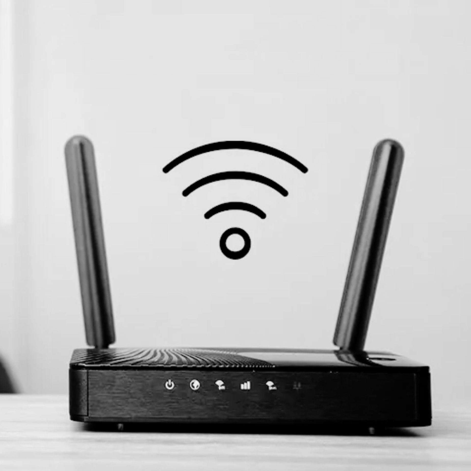 Black Wi‑Fi router with two antennas and a wireless signal icon on a gray background
