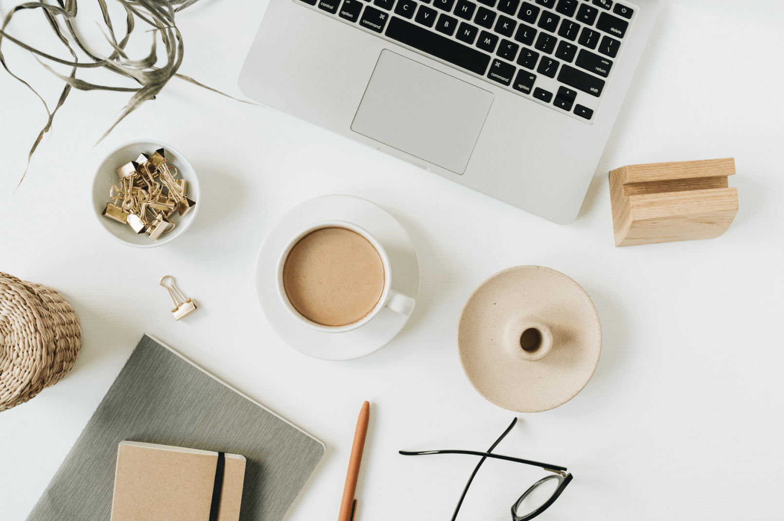 GK Marketing Online | A laptop computer is sitting on a desk next to a cup of coffee.