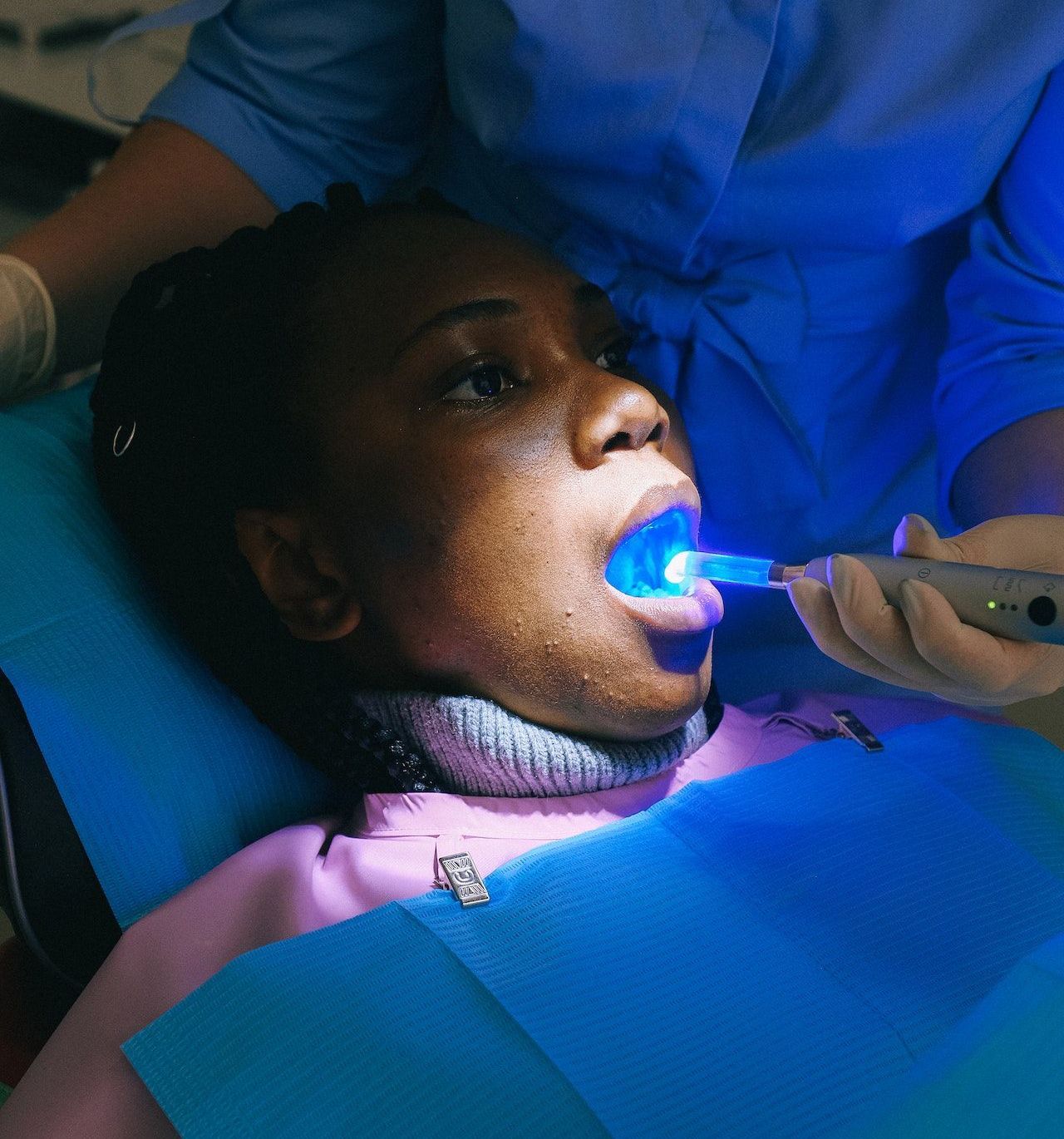Get dental bonding in Oak Point 75068. Patient taking a dental exam