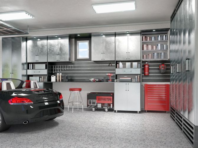 Modern garage with a black car, red tool cabinets, and storage shelves