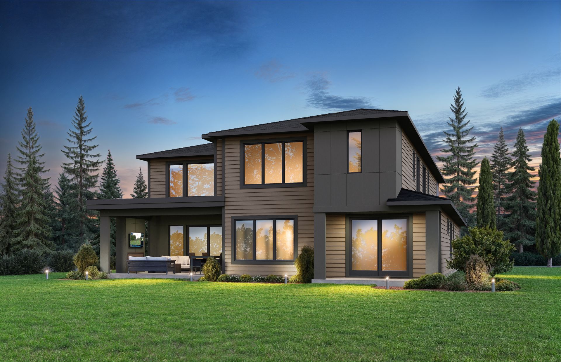 Modern two-story house with warm lit windows at dusk, surrounded by grass and evergreen trees