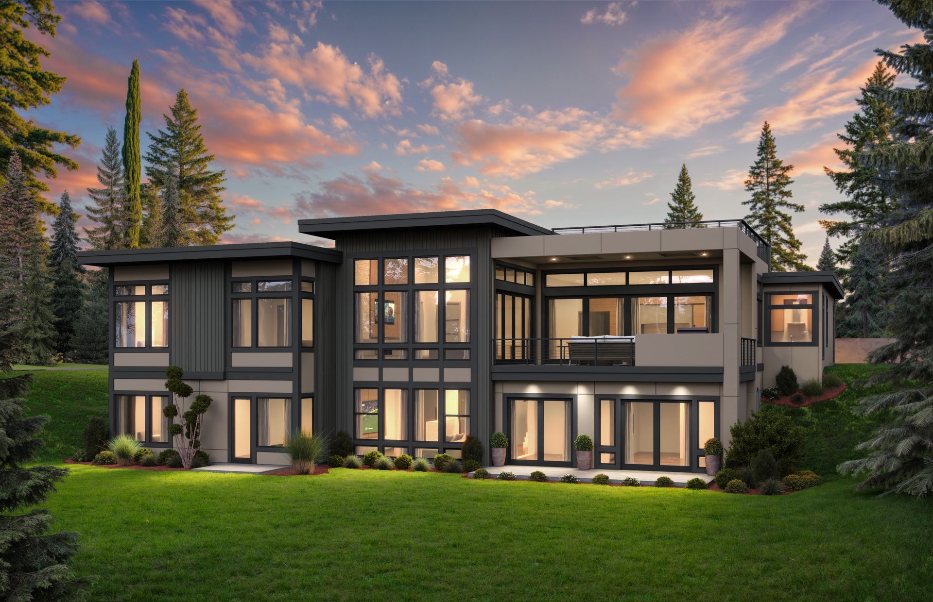 A modern two-story home with large windows and a sunset sky, set on a grassy hill surrounded by evergreen trees.