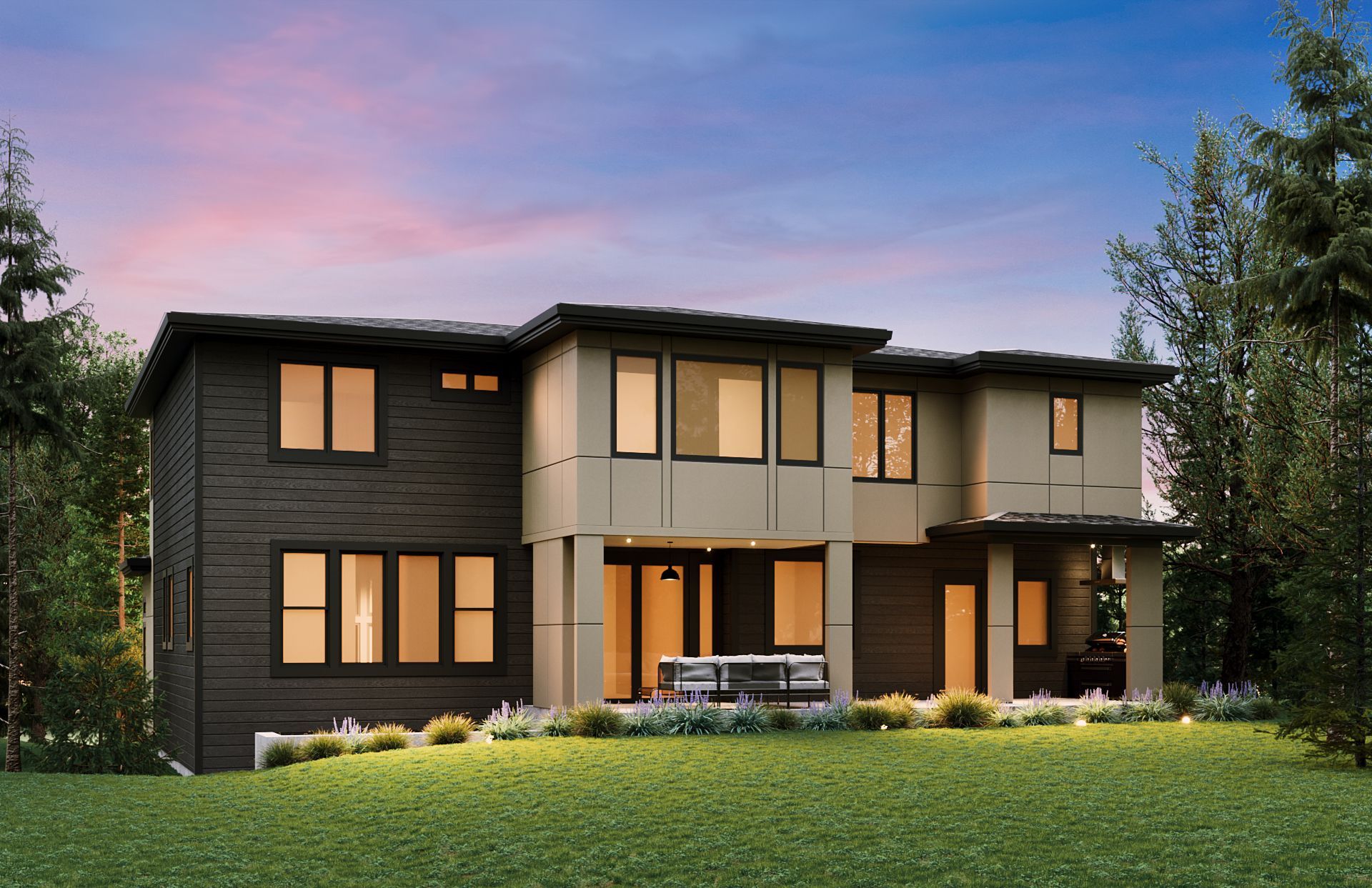 Modern two-story house with dark siding and beige accents, nestled in a treed yard at twilight.