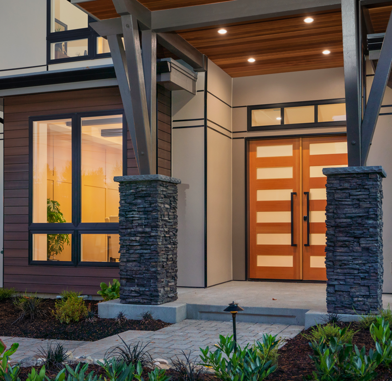 The front of a house with a large inviting double door