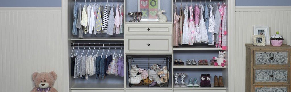 A white bookshelf filled with books and toys