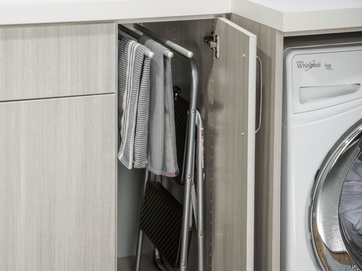 A washer and dryer are in a laundry room.