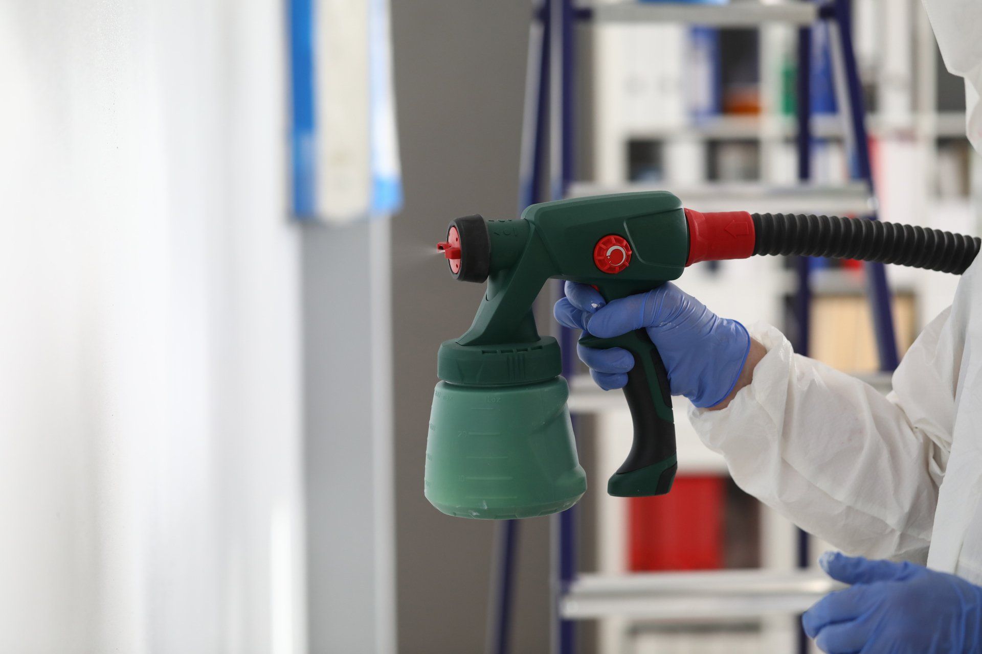 Professional Technician Performing Electrostatic Spraying Service