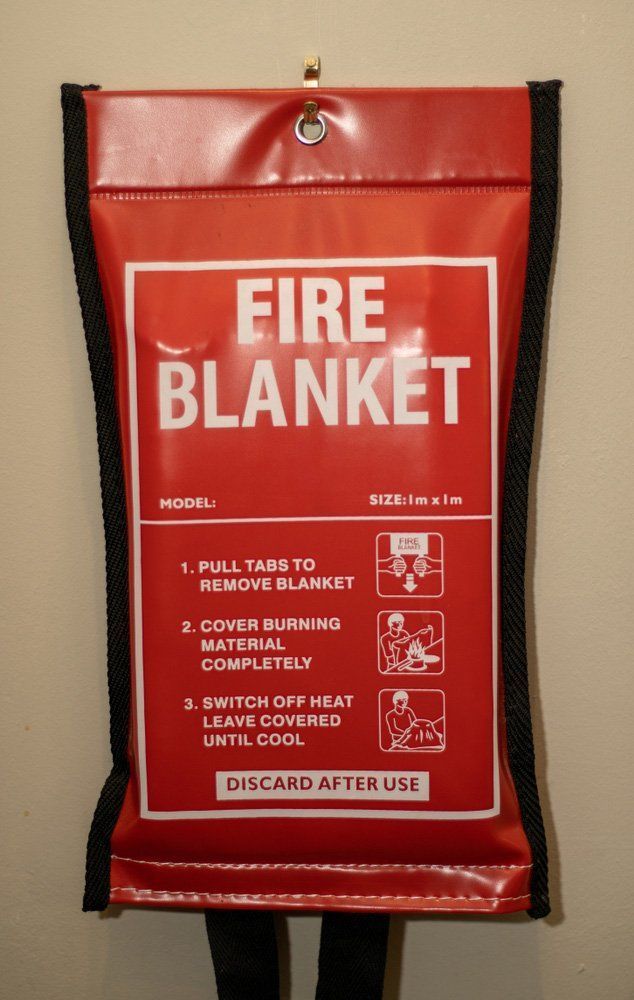 Red Fire Blanket in a Black Case With Instructions — Fire Maintenance Services (NT) Pty Ltd in Winnellie, NT