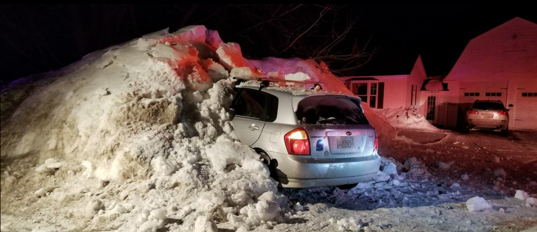vehicle stuck in snowbank in buffalo winter.