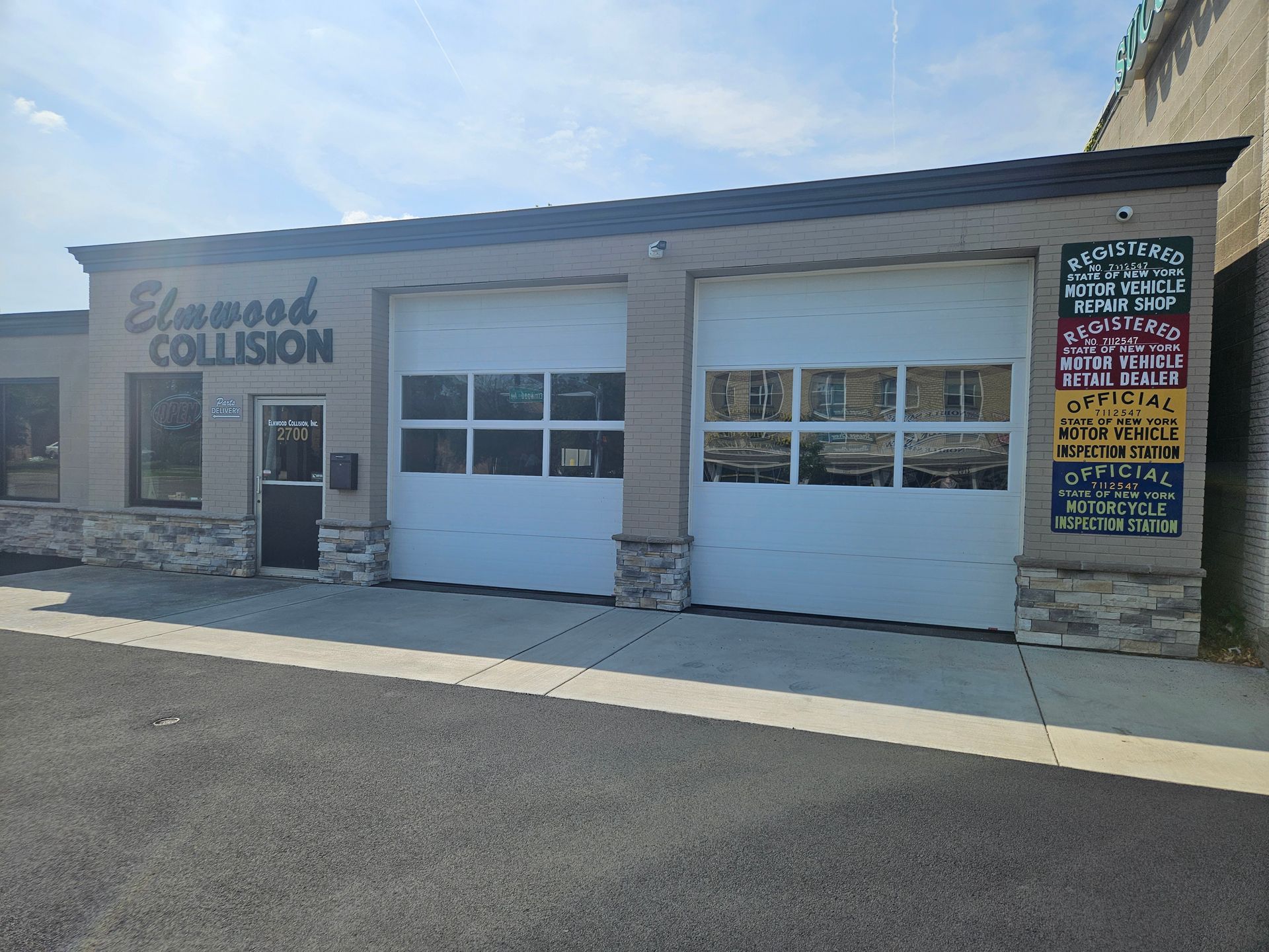 Exterior view of Elmwood Collision auto body shop in Buffalo, NY.