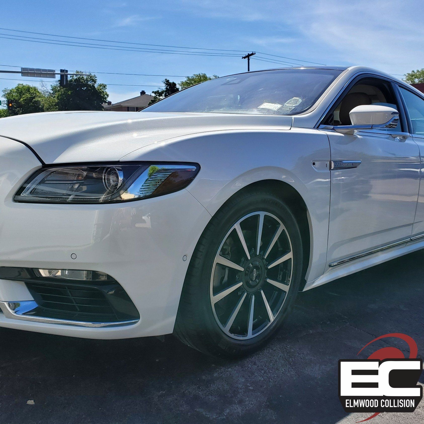 new fender, bumper, hood, and headlight installed on a lincoln continental at elmwood collision
