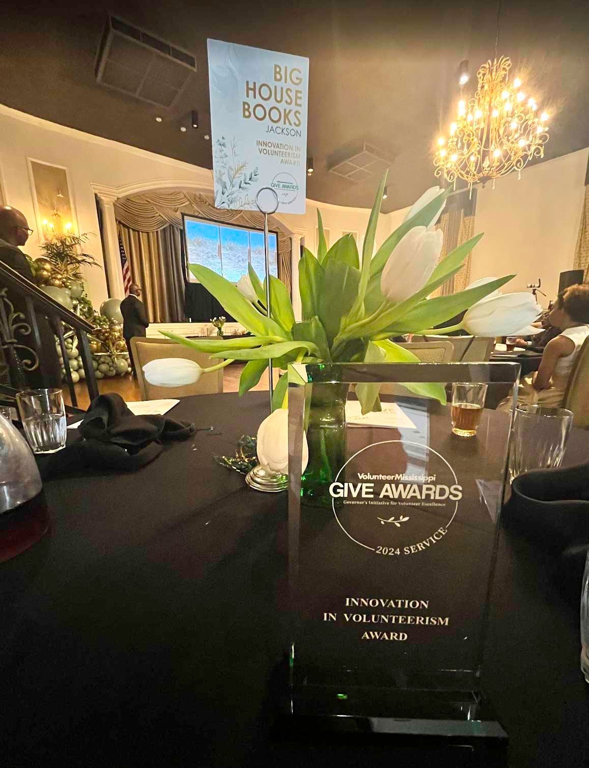 Award on table with flowers and a 