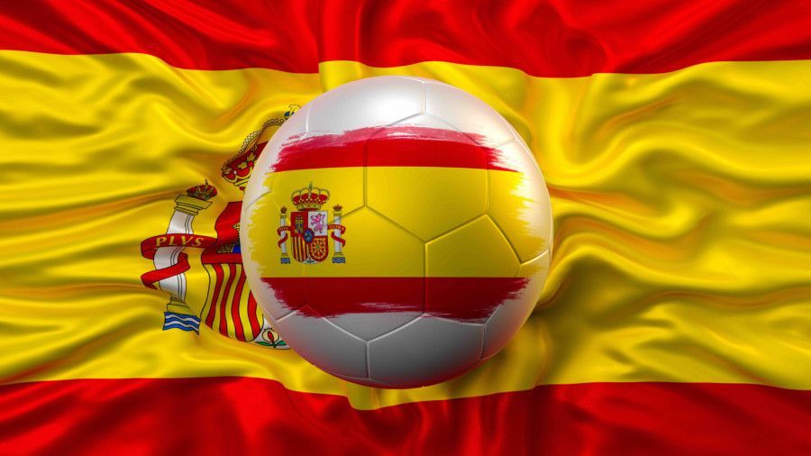 Spanish flag with a soccer ball in the center and a smaller Spain emblem on the left