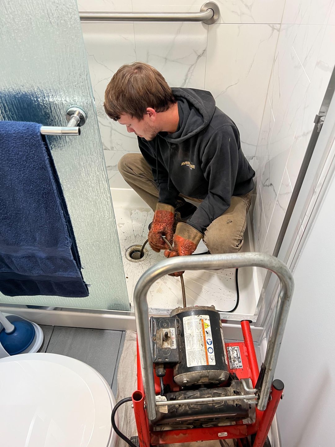 Man cleaning the drain — Farmersville, OH — Moore Sewer Services