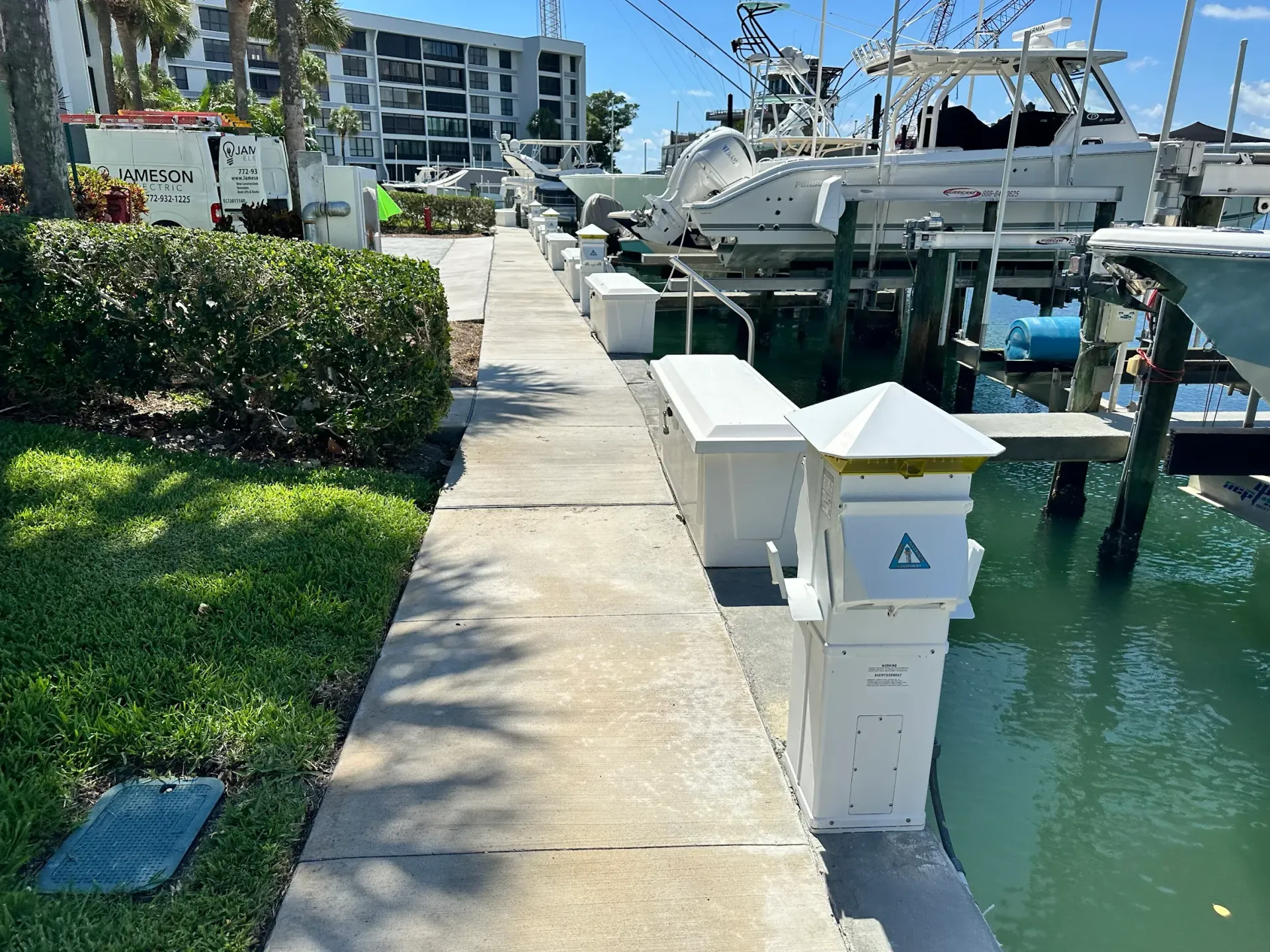 A walkway leading to a dock with boats docked