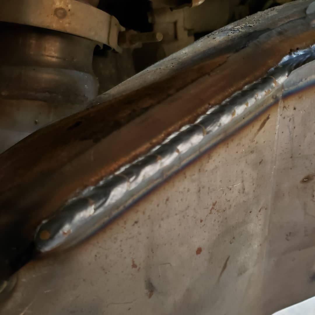 A close up of a piece of metal with a weld on it.