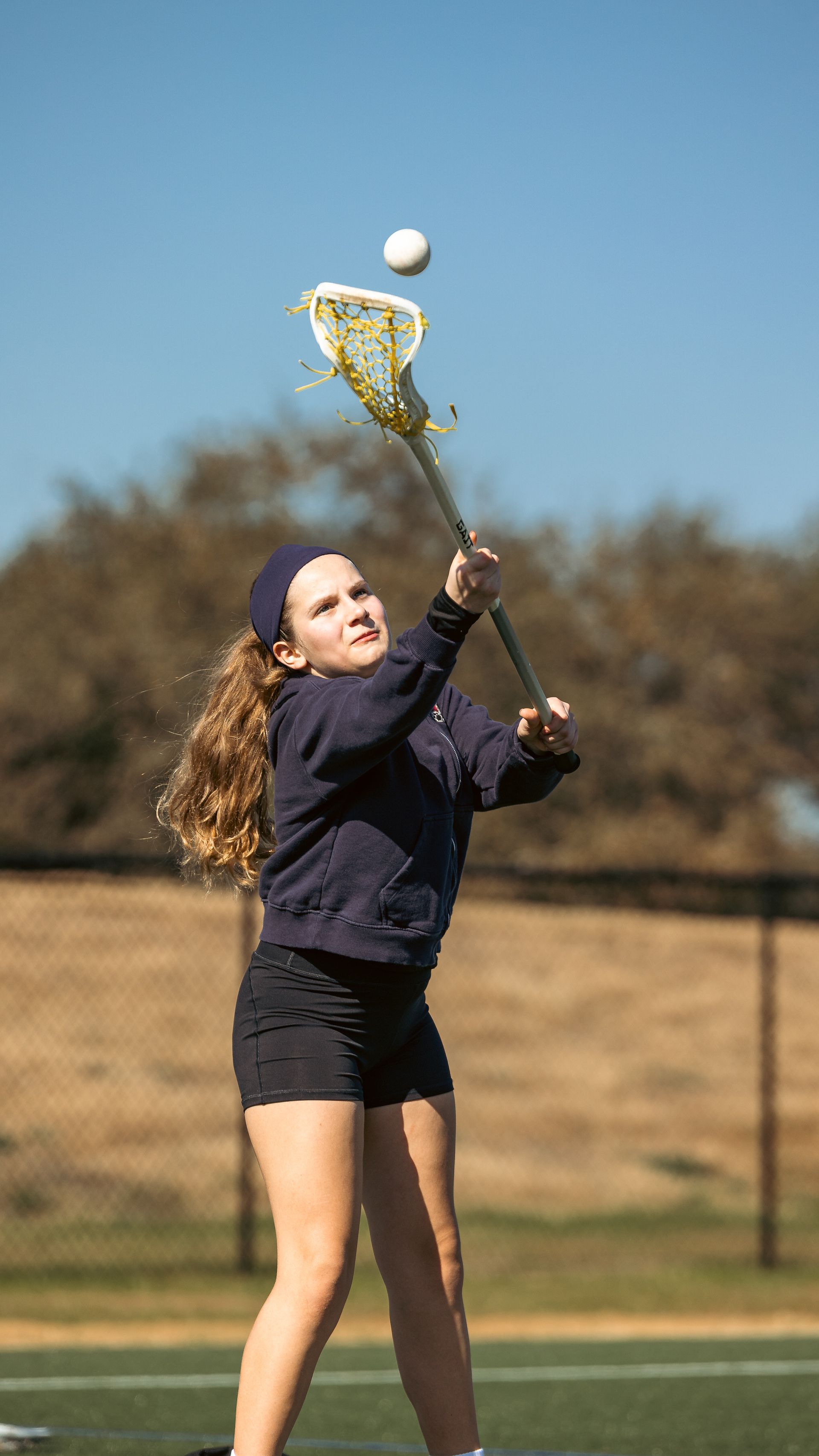 Albion Lacrosse Club player catching the ball