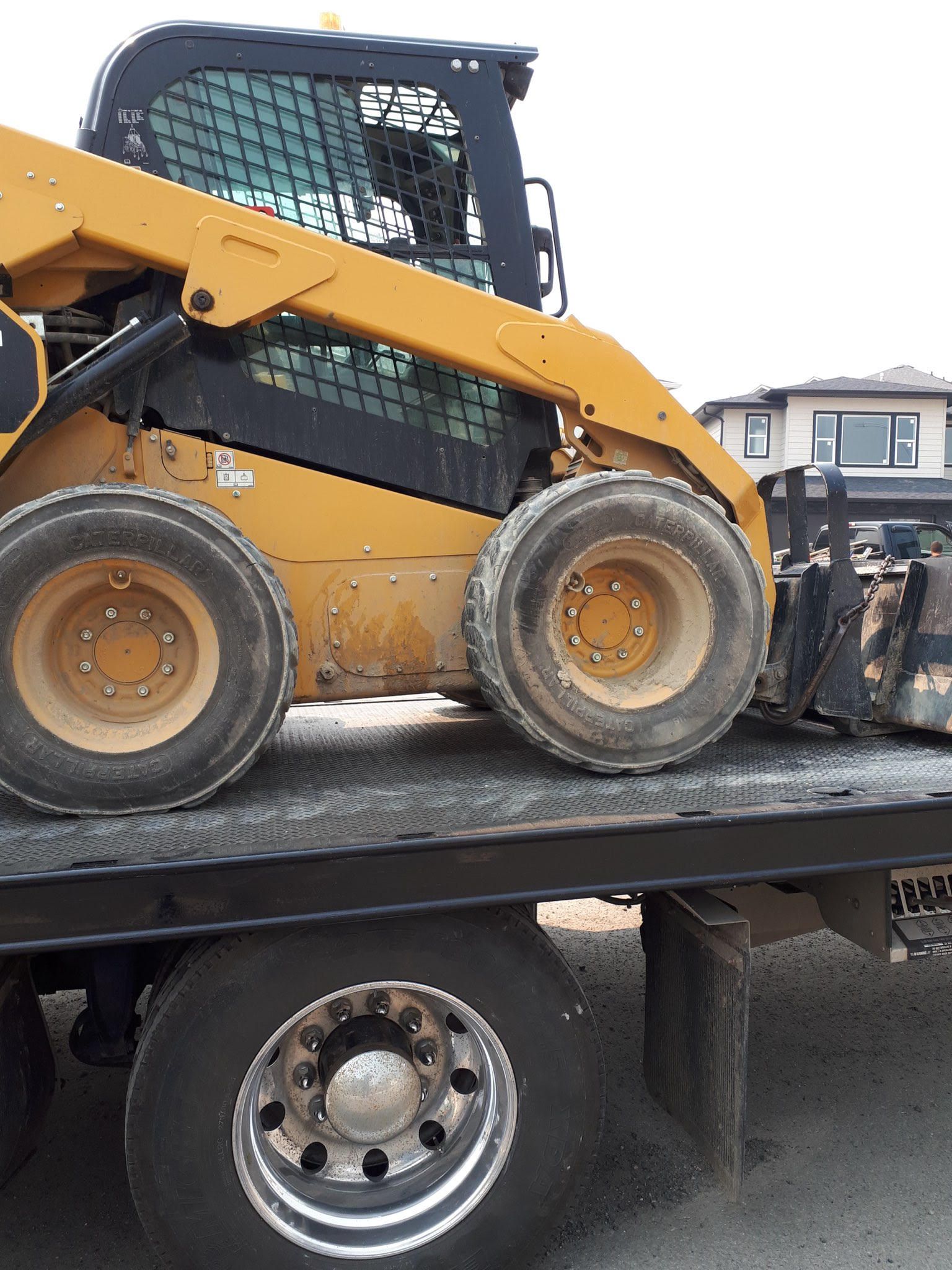 towing a mine excavator on a tow truck