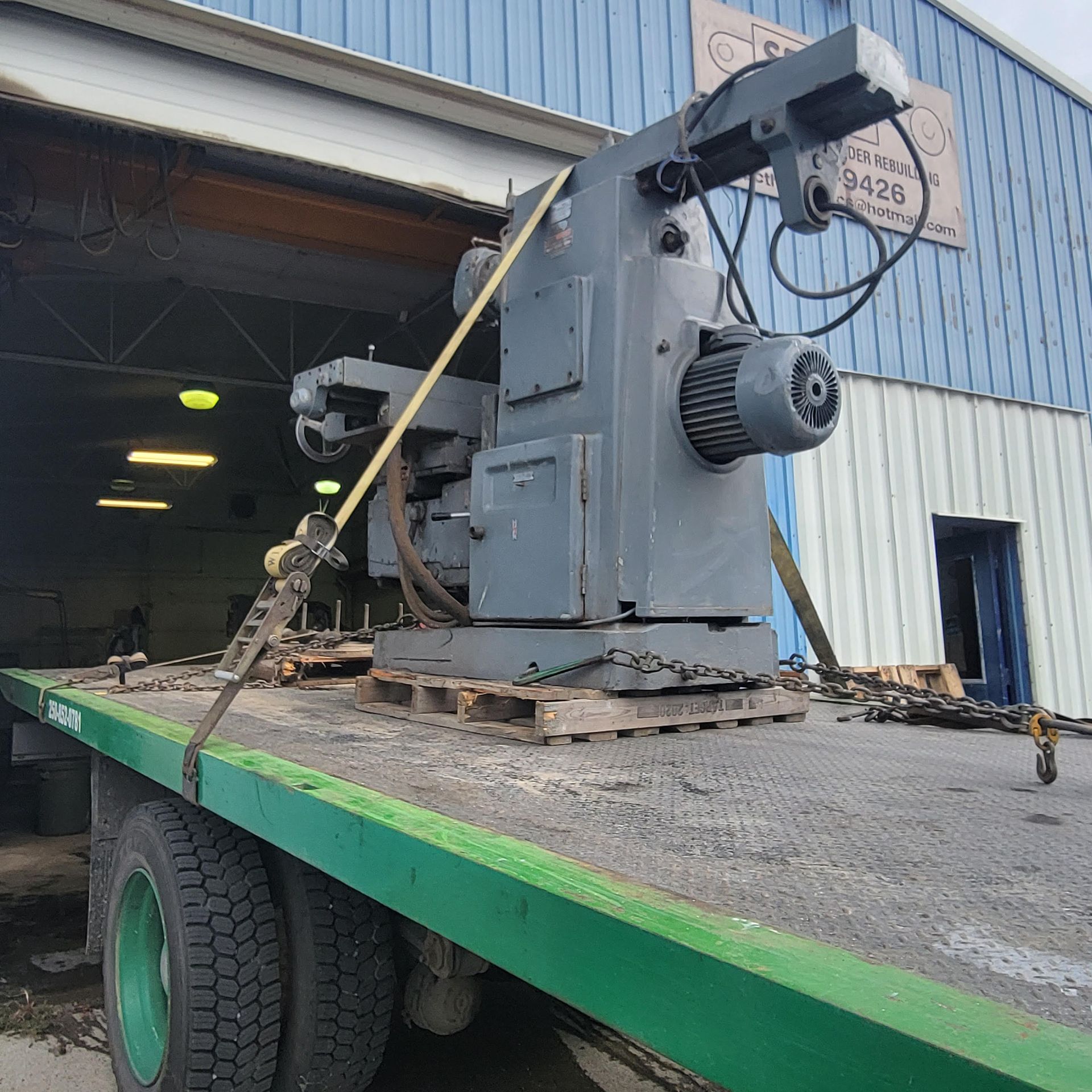 industrial machine loaded onto tow truck in Kamloops