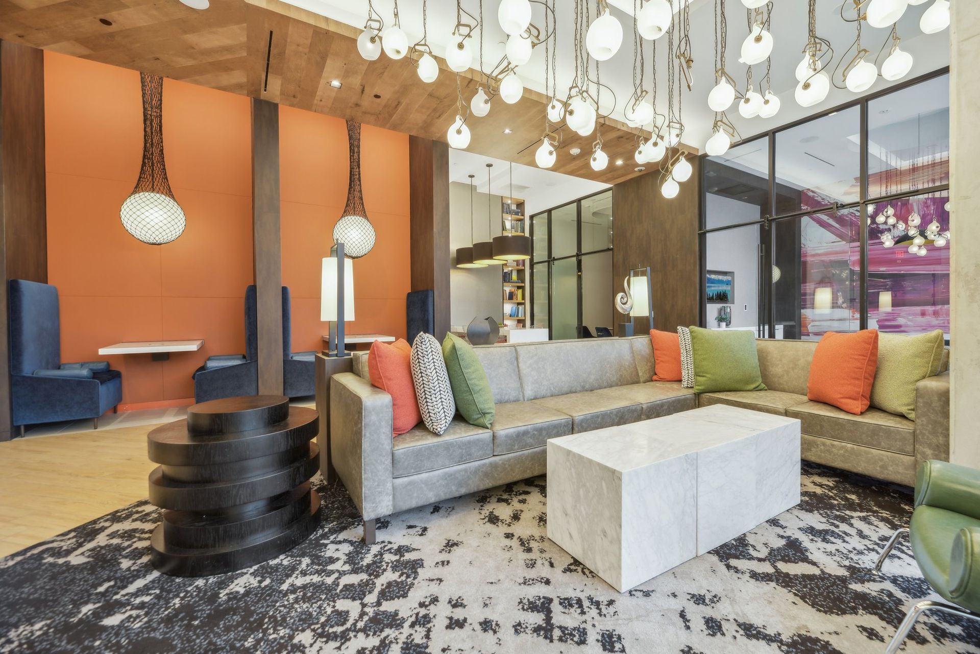 Clubhouse with a couch and a coffee table at Solaire 8200 Dixon offers apartments in Silver Spring, MD.