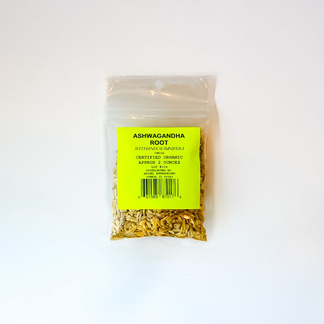 Small clear plastic bag with a bright yellow label, partly filled with dried plant pieces on a white background.
