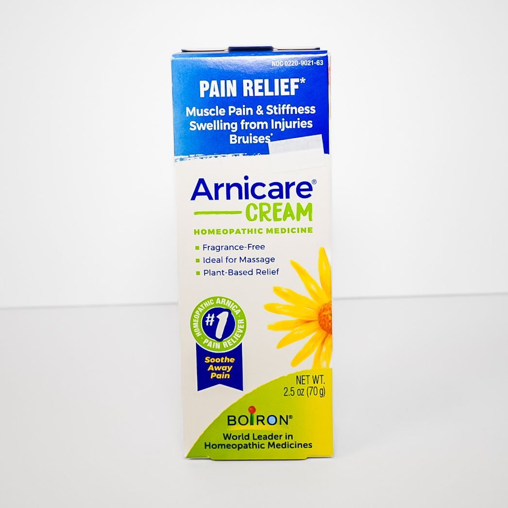 Boiron Arnicare Cream pain relief tube box, white and blue with yellow flower graphic