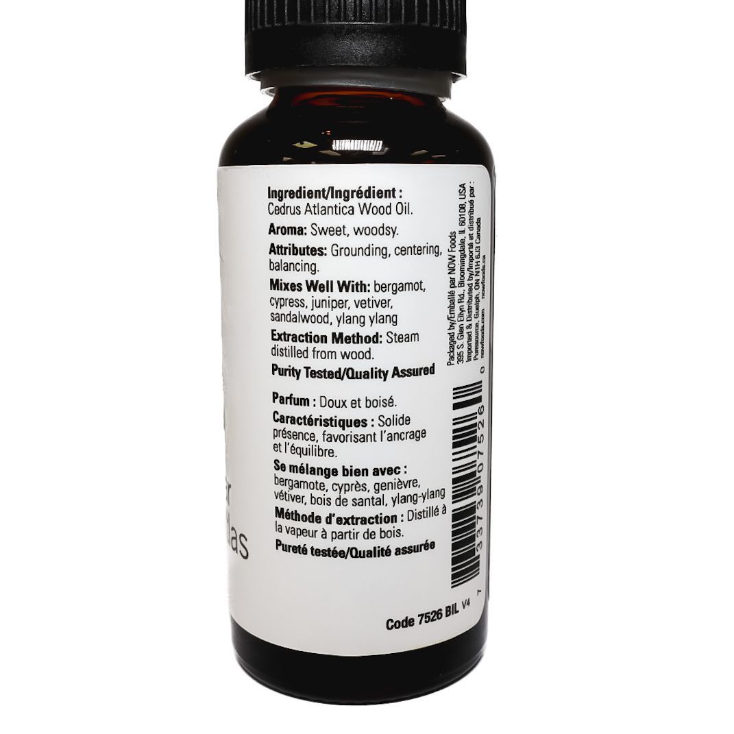 Black supplement bottle with white label showing product information, isolated on a white background