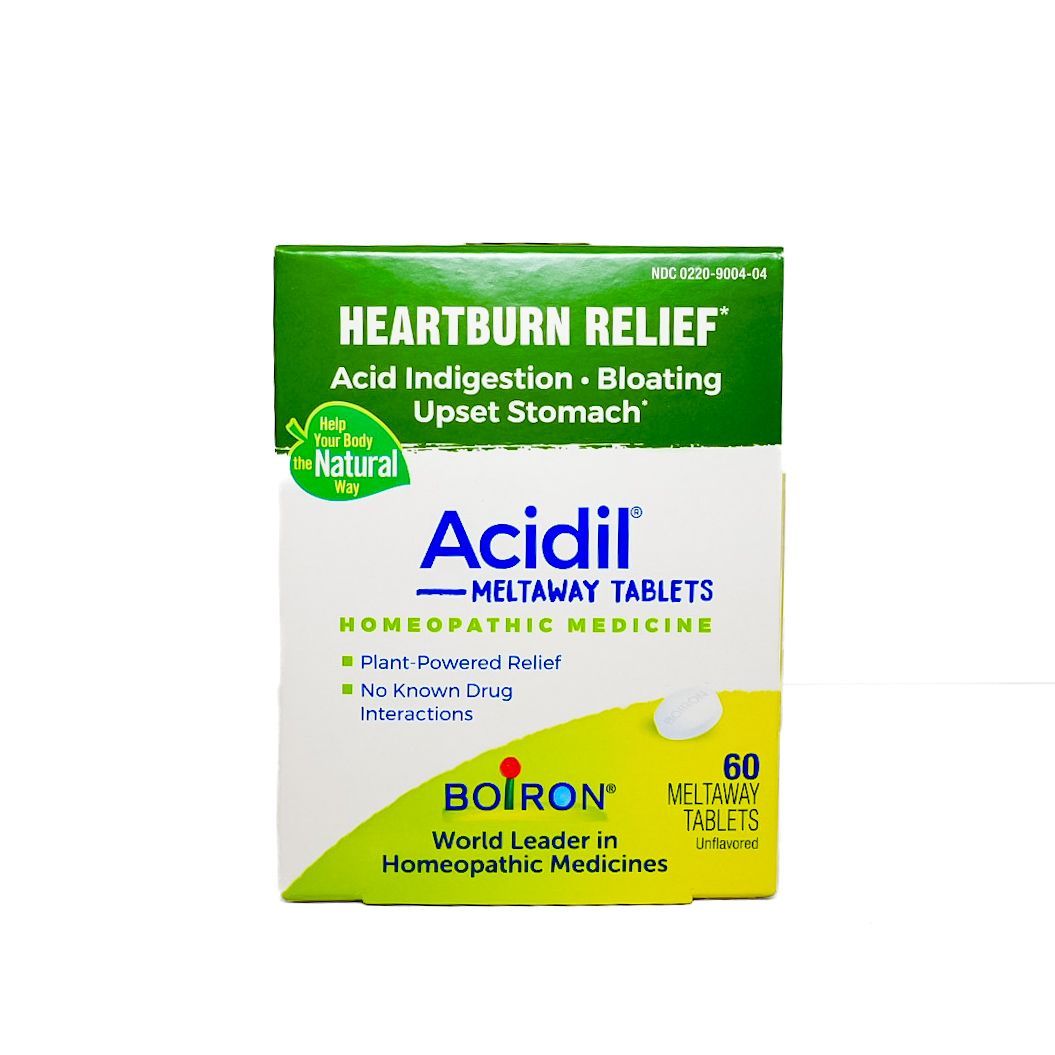 Green and white Acidiil antacid tablets box labeled “Heartburn Relief” and “Acid Indigestion”